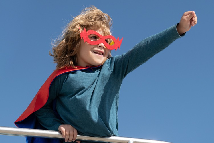Child striking a superhero pose